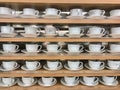 Rows of white tea cups Royalty Free Stock Photo