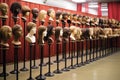 rows of wigs on mannequin heads, various styles