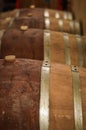 Rows of Wine Barrels Stacked in Winery Cellar Royalty Free Stock Photo