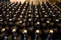 Rows of wine bottles in cellar Royalty Free Stock Photo