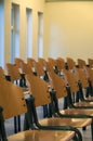 Rows of wooden chairs