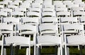 Rows of wooden chairs set up for wedding Royalty Free Stock Photo