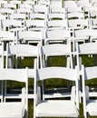 Rows of wooden chairs set up for wedding Royalty Free Stock Photo