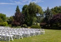 Rows of wooden chairs set up for wedding Royalty Free Stock Photo