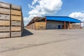 Rows of wooden crates boxes and pallets for fruits and vegetables in storage stock. production warehouse. Plant Industry