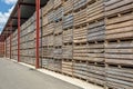 Rows of wooden crates boxes and pallets for fruits and vegetables in storage stock. production warehouse. Plant Industry