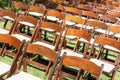 Rows of Wooden Event Chairs at Wedding Venue Abstract Royalty Free Stock Photo