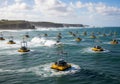 Rows of yellow buoys with tall structures sit on the ocean surface, Royalty Free Stock Photo