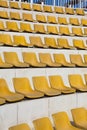 Rows of yellow empty bleacher seats Royalty Free Stock Photo