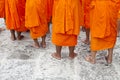 Rows of young Thai Buddhist novice monks standing