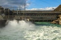 Water pouring out of a spillway at the Roxburgh Hydro Dam, New Zealand Royalty Free Stock Photo