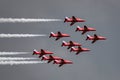 Royal Air Force RAF Red Arrows formation aerobatic display team flying British Aerospace Hawk T.1 Jet trainer aircraft. Royalty Free Stock Photo