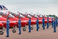 Royal Air Force RAF Red Arrows ground crew members give directions to the pilots in their British Aerospace Hawk T.1 jet trainer