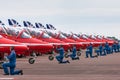 Royal Air Force RAF Red Arrows ground crew prepare the British Aerospace Hawk T.1 aircraft to taxi out for takeoff.