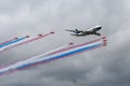 Royal Air Force Red Arrows Display Team in formation with a British Airways Boeing 747