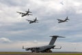 Royal Australian Air Force RAAF Boeing C-17A Globemaster III Large military cargo aircraft unloading a Bushmaster Armored person