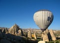 Royal ballons flying in the sunrise light in Cappadocia, Turkey above the Fairy ChimneysÃÂ rock formationÃÂ nearby Goreme