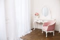 Boudoir room with pink soft armchair.