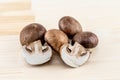 Royal big brown champignons whole and half on a wooden background Royalty Free Stock Photo