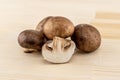 Royal brown champignons large stacked on a wooden cutting board Royalty Free Stock Photo