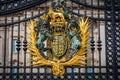 Royal coat of arms on the main gates of Buckingham Palace, London, UK