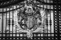 Royal coat of arms of the United Kingdom on the main gates of Buckingham Palace in London, UK Royalty Free Stock Photo