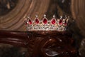 Royal crown with red gems. Ruby, garnet. Symbol of power and authority Royalty Free Stock Photo