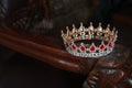 Royal crown with red gems. Ruby, garnet. Symbol of power and authority Royalty Free Stock Photo