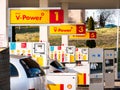 Royal Dutch Shell gas station, cars refueling, gas pumps closeup, Shell V-Power. Gas, gasoline petrol industry business, economy Royalty Free Stock Photo