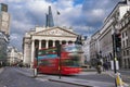 The Royal Echnage building with moving red double decker bus on the move