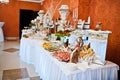 Royal elegance wedding reception table with different cookery food.