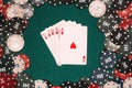 Royal flush on the background of gaming chips on the green table Royalty Free Stock Photo