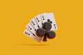 Royal Flush Clubs Suit with Casino Chip on Yellow Royalty Free Stock Photo