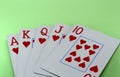 Royal flush of a heart on a green background close-up Royalty Free Stock Photo