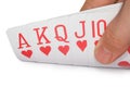 Royal flush of hearts, cards in human hand