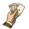 Royal flush in hearts. Male hand holding a game card.