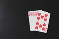 Royal flush poker hands on a black background, playing cards, copyspace for you marketing text Royalty Free Stock Photo