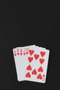 Royal flush poker hands on a black background, playing cards, copyspace for you marketing text Royalty Free Stock Photo
