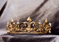 Royal gold crown with fleur de lys elements. Luxury