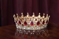 Royal golden crown with red stones. Garnet, ruby