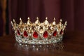 Royal golden crown with red stones. Garnet, ruby
