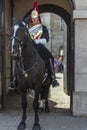 Royal guard sitting in a horse guarding a door