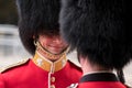 Royal Guard soldiers having an intimate conversation during the Trooping the Colour military ceremony, held once a year in London