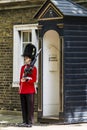 Royal Guard standing near a booth