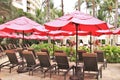 Royal Hawaiian Hotel, Honolulu, Hawaii -4/27/2018 - Lounge chairs and umbrellas by the pool at the Royal Hawaiian Hotel in Hawaii Royalty Free Stock Photo