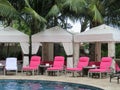 Royal Hawaiian Hotel, Honolulu, Hawaii -4/27/2018 - Lounge chairs and umbrellas by the pool at the Royal Hawaiian Hotel in Hawaii Royalty Free Stock Photo