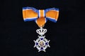 Royal honor as a member of the order of Oranje Nassau, which is often awarded to people who volunteer for a long time for society Royalty Free Stock Photo