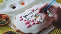 Royal icing cookie decorating with special food brush and colors