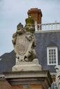 Royal lion statue guards at the gate of the governors mansion