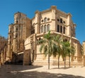 the Royal Monastery of San JerÃÂ³nimo from Calle CompÃÂ¡s de San JerÃÂ³nimo on a sunny day with clear skies in Malaga, Spain Royalty Free Stock Photo